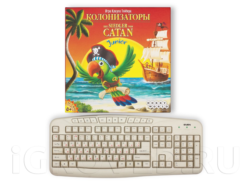 Коробка настольной игры Колонизаторы Junior по сравнению с клавиатурой