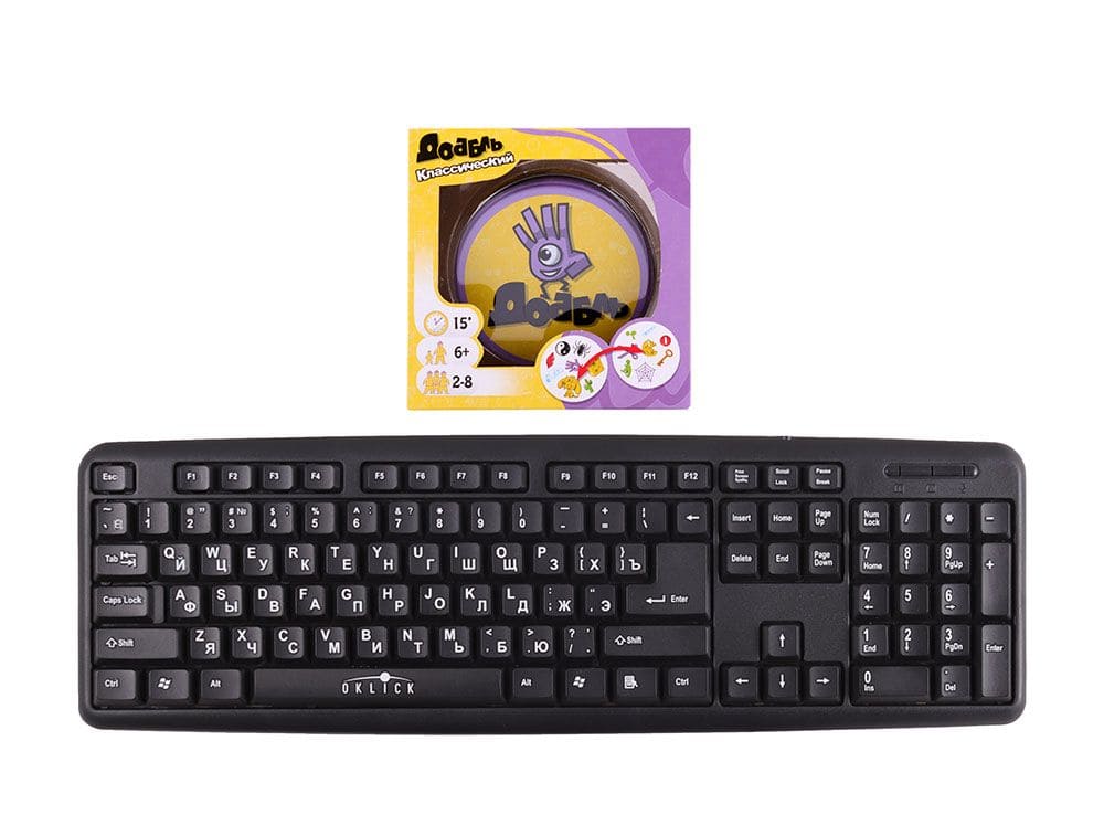 Коробка настольной игры Доббль (Dobble или Spot It!) в сравнении с клавиатурой
