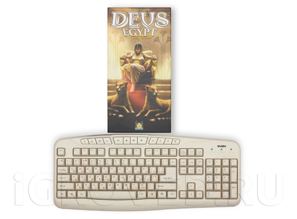 Коробка настольной игры Деус: Египет в сравнении с клавиатурой