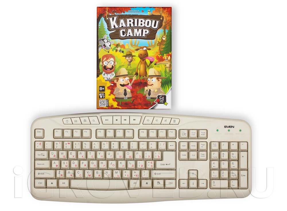 Коробка настольной игры Лагерь Карибу (Кaribou Camp) в сравнении с клавиатурой